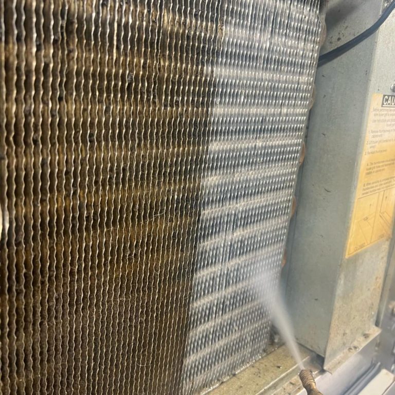 Condenser Cleaning A close-up of a cooling coil being cleaned with water.